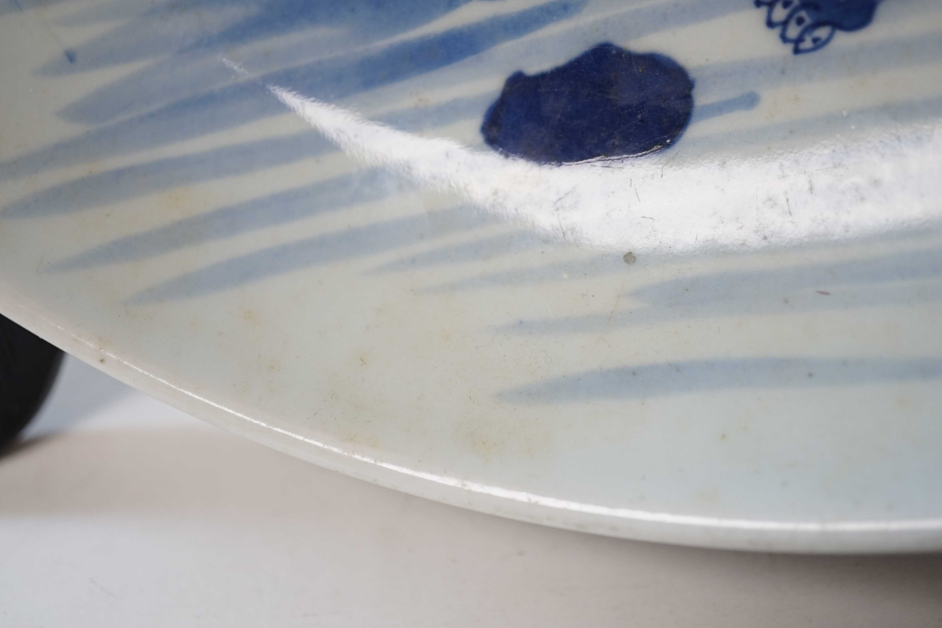A large Chinese blue and white ‘mythical beasts’ saucer dish, Yongzheng period